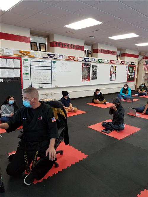 Mr. White and the Karate students in class 